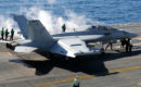 An EA 18G Growler assigned to Electronic Attack Squadron 141 prepares to take off from the aircraft carrier USS George H.W. Bush.