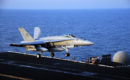 FA 18C Hornet lands on the flight deck of the aircraft carrier USS George H.W. Bush