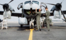 Pre flight inspection of an OV 1D Mohawk surveillance aircraft