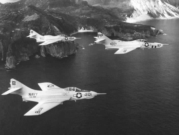 Two U.S. Navy Grumman F9F 8B Cougar of Attack Squadron VA 192 Golden Dragons and an F9F 8P of Photographic Reconnaissance Squadron VFP 61