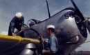 U.S. Navy sailors refuel a Curtiss SNC 1 Falcon training plane.